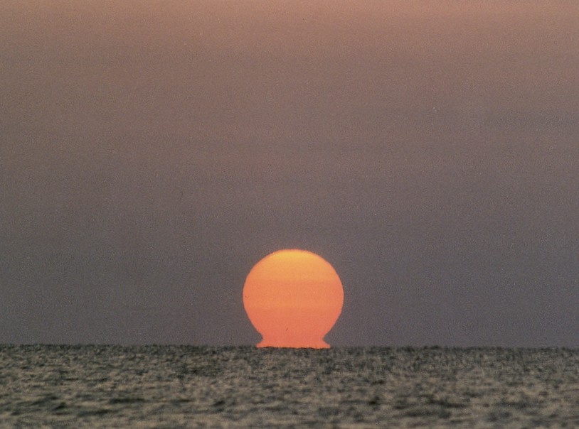 Omega stage of an inferior-mirage sunset