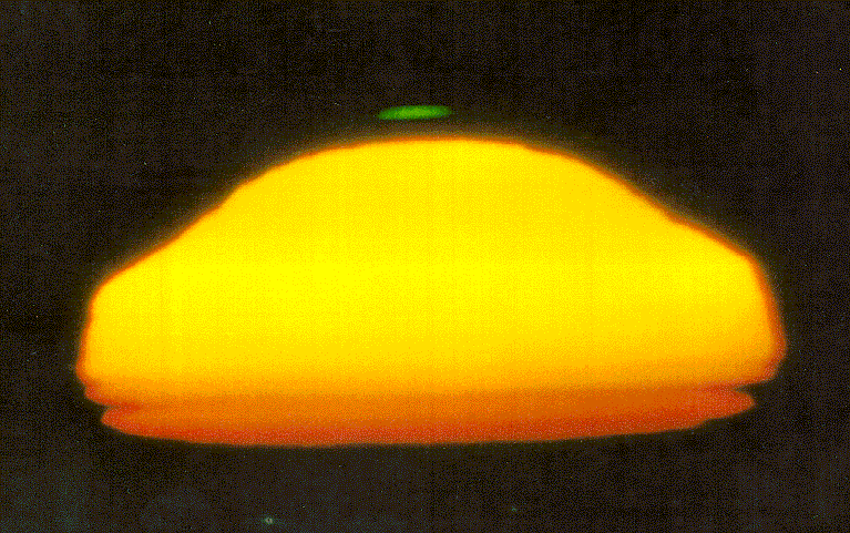 A mock­mirage green flash, photographed at Alpine, CA.